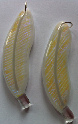 Click for a larger photo of the Clear Glass with Yellow/Violet/Blue Dichroic Glass on White Glass Feather Necklace